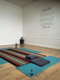 a room with a yoga mat on the floor